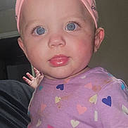 Lillian is registered to the contest to win money with this photo: baby, child, infant, face, headband, pink, purple, hearts, shirt, blue_eyes, tongue_out, curious, closeup, cute, person, indoor, smudge, clothing, apparel, portrait