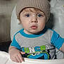 Isaiah joined the competition — help win amazing prizes! toddler, child, hat, knit_hat, high_chair, blue_eyes, shirt, crumbs, food, indoor, person, face, expression, cute, baby, clothing, hand, table, snack, curious