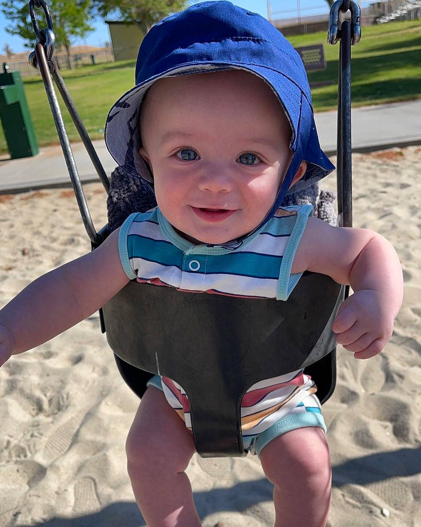 Jackson is registered to the contest to win money with this photo: azure, baby, baby_toddler_clothing, baseball_cap, blue, cap, cool, fun, happy, hat, headwear, leisure, person, photograph, plant, recreation, skin, sleeve, smile, summer