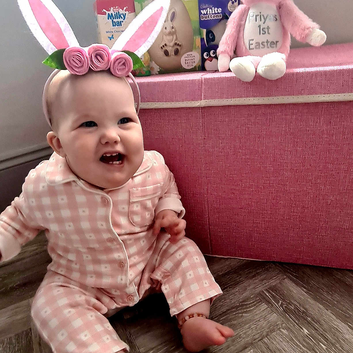 Priya is registered to the contest to win money with this photo: baby, babylaughing, clothing, face, happy, head, homedecor, laughing, pajamas, pants, person, photography, plush, portrait, sitting, smile, tape, toy