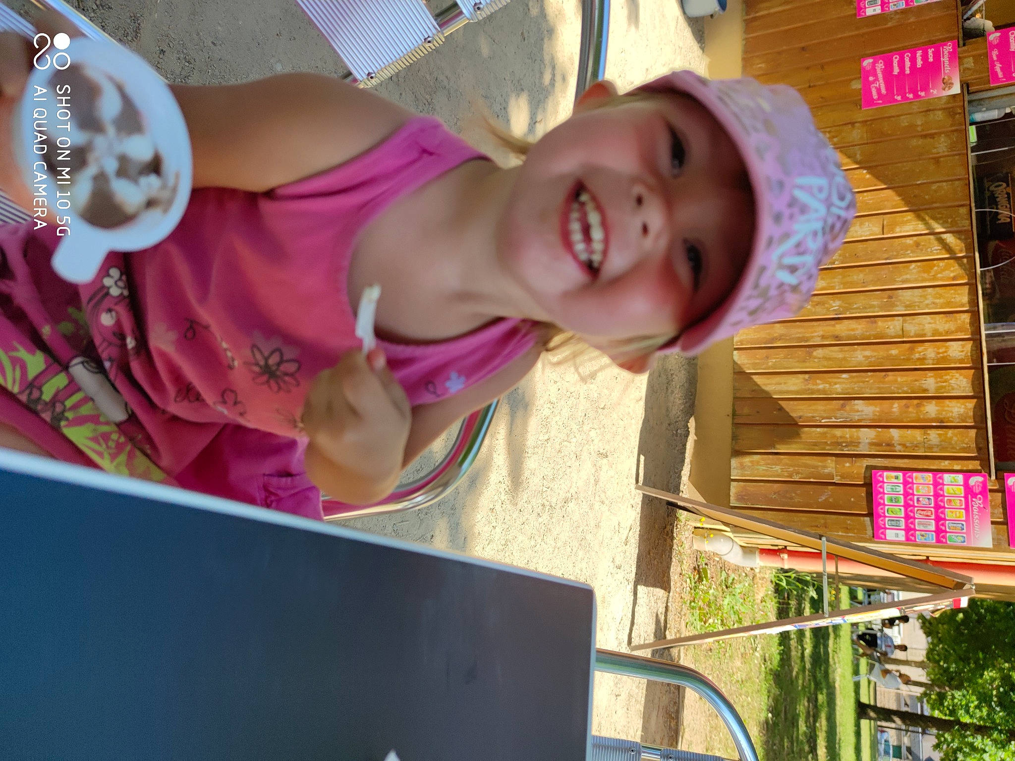 Shayna a rejoint le concours — aidez-le/la à gagner de superbes lots ! baby_toddler_clothing, computer, cup, ear, facial_expression, happy, headwear, jaw, jewellery, joy, laptop, laugh, magenta, mouth, nose, person, personal_computer, pink, smile, toddler