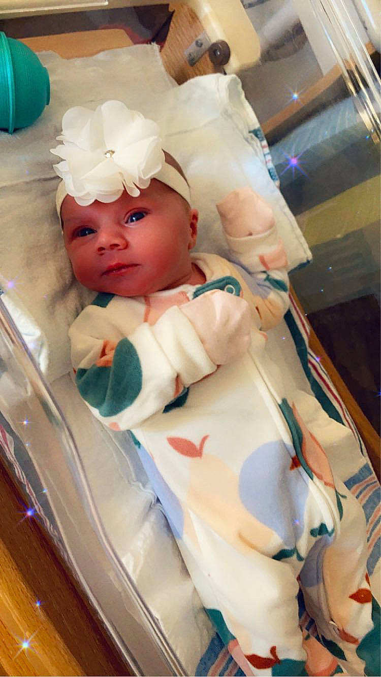 Alexis is registered to the contest to win money with this photo: baby, baby_products, baby_safety, baby_toddler_clothing, cap, child, eyelash, fun, glass, hat, headwear, person, play, room, service, sitting, skin, toddler, vacation, vehicle_door