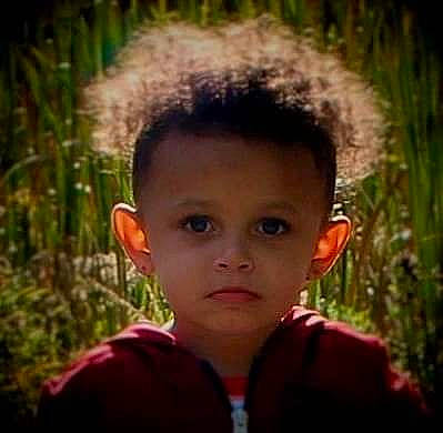 Andre Jr is registered to the contest to win money with this photo: adaptation, cheek, child, cool, ear, face, facial_expression, forehead, fun, grass, hair, hairstyle, happy, head, headgear, human, nose, person, portrait, smile