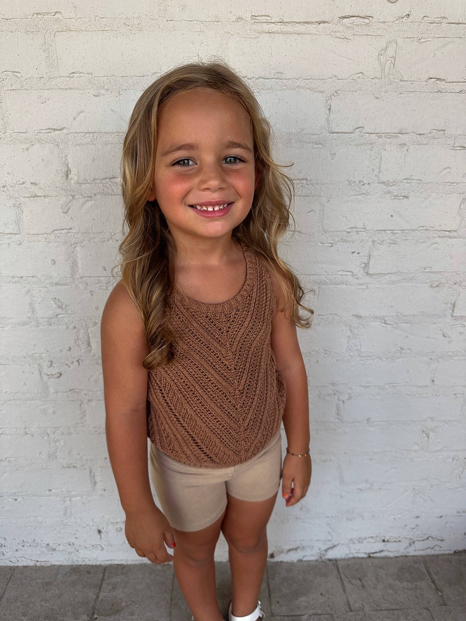 Saylor is registered to the contest to win money with this photo: active_tank, baby_toddler_clothing, clothing, eye, face, hair, happy, human_body, iris, joint, joy, knee, long_hair, neck, pattern, person, shoulder, sleeve, smile, thigh