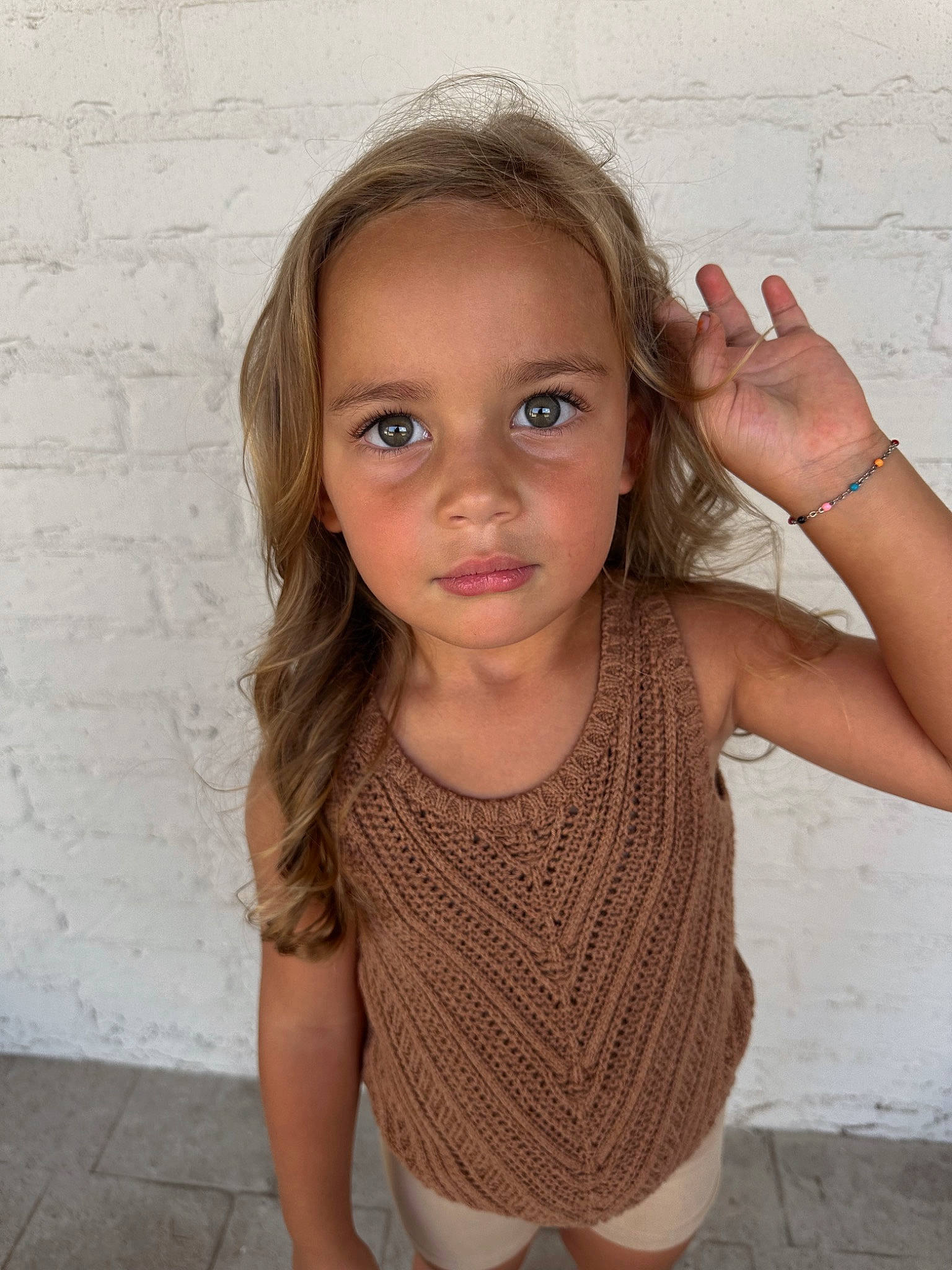 Saylor is registered to the contest to win money with this photo: arm, cheek, chin, eyebrow, eyelash, face, gesture, hair, hand, happy, human_body, iris, joint, lip, neck, nose, person, shoulder, skin, sleeve