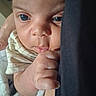 Xavier joined the competition — help win amazing prizes! baby, close_up, face, hand, blanket, infant, skin, eyes, curious, soft_lighting, fabric, cute, newborn, portrait, fingers, child, person, sleepwear, resting, indoors