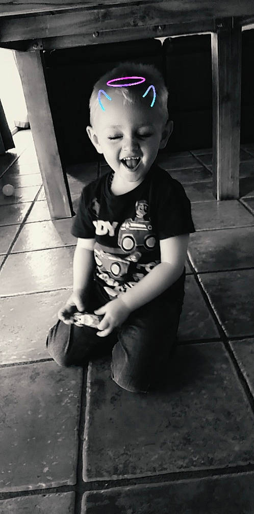 Harlan is registered to the contest to win money with this photo: baby, black, black_and_white, child, floor, flooring, monochrome, person, photograph, photography, play, sitting, smile, snapshot, standing, style, toddler