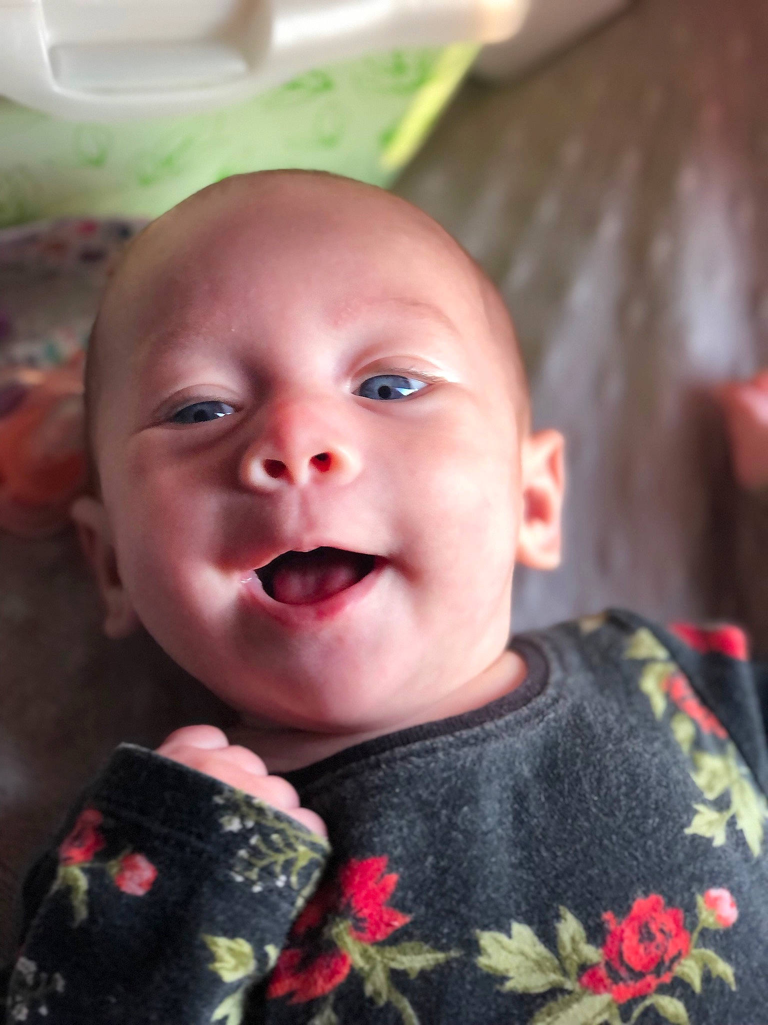 Nova is registered to the contest to win money with this photo: baby, baby_toddler_clothing, cheek, child, eyelash, flash_photography, fun, happy, laugh, lip, mouth, nose, pattern, person, pink, plant, sitting, skin, sleeve, smile