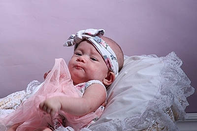 Nova is registered to the contest to win money with this photo: baby, baby_toddler_clothing, bridal_accessory, comfort, embellishment, event, eye, fashion_accessory, flash_photography, grass, hair_accessory, happy, headband, headpiece, headwear, jewellery, linens, person, portrait_photography, room