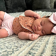 Skyla joined the competition — help win amazing prizes! baby, sleeping, bow, onesie, blanket, infant, cute, peaceful, cozy, soft, face, hand, legs, pink, brown, pattern, headwear, indoor, portrait, child