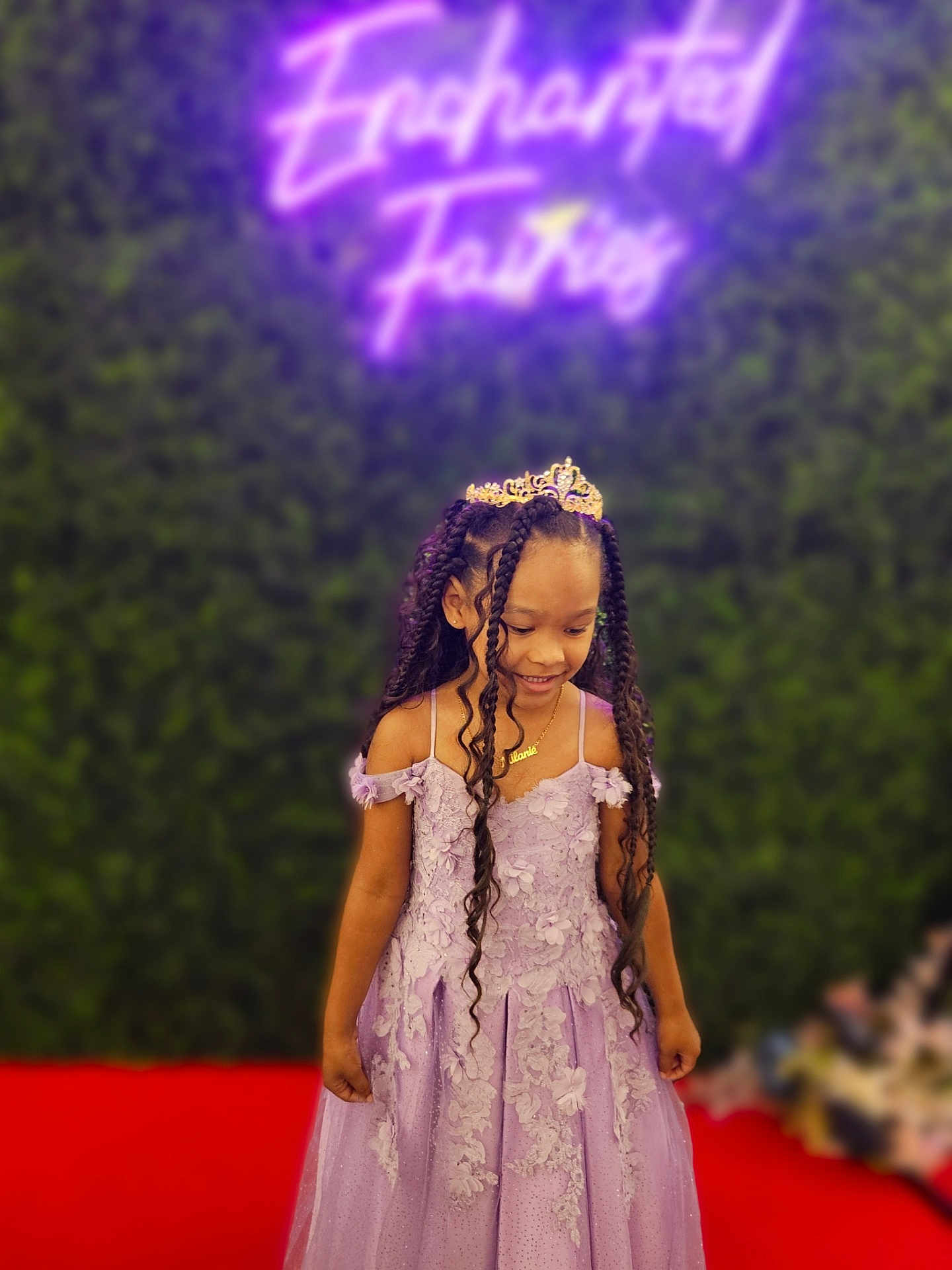 Milanie is registered to the contest to win money with this photo: child, girl, princess, dress, lavender, tiara, braids, red_carpet, smile, portrait, green_background, neon_sign, event, happy, fashion, young, celebration, cute, standing, indoor