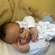 Devonte joined the competition — help win amazing prizes! baby, sleeping, couch, blanket, infant, child, face, peaceful, rest, soft, cozy, indoors, clothing, person, portrait, hand, curly_hair, comfort, relax, home
