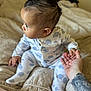 Devonte joined the competition — help win amazing prizes! baby, infant, child, pajamas, elephant_pattern, bed, hand, tattoo, holding_hand, curious, indoors, soft_light, sleepwear, person, cute, sitting, skin, comfort, blanket, young