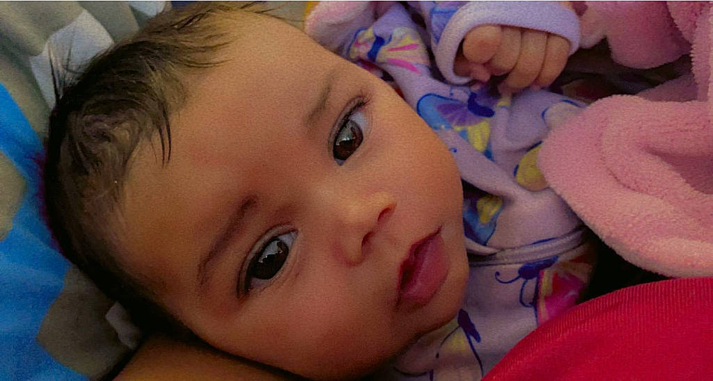 Jacqueline is registered to the contest to win money with this photo: baby, brown_hair, cheek, child, close_up, comfort, ear, eyebrow, eyelash, facial_expression, finger, forehead, happy, human_body, iris, lip, mouth, nose, person, skin