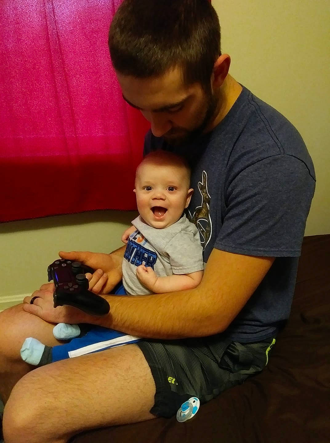 Cannon is registered to the contest to win money with this photo: abdomen, arm, baby, cheek, child, ear, father, fathers_day, finger, hand, joint, lap, leg, male, person, sitting, skin, toddler