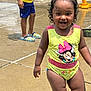 Zoey joined the competition — help win amazing prizes! blue_shorts, child, crocs, curly_hair, fun, happy, minnie_mouse, outdoor, person, play, playground, smiling, splash, summer, sunny, swimsuit, toddler, water_play, wet_ground, yellow_clothing