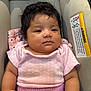 baby, infant, child, car_seat, clothing, pink_shirt, mittens, portrait, cute, face, young_child, indoor, seat, child_safety, fabric, soft_lighting, person, closeup, expressionless, polka_dot