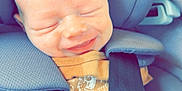 Waylon is registered to the contest to win money with this photo: baby, car_seat, smiling, infant, pacifier, blue, straps, child, happy, seatbelt, closeup, cute, safety, toddler, headrest, soft, clothing, infant_toddler, face, relaxing