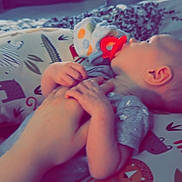 Waylon joined the competition — help win amazing prizes! baby, hand, pacifier, blanket, animal_pattern, infant, bedroom, furniture, drawer, basket, clothing, person, holding_hands, lying_down, soft_lighting, toddler, comfort, indoor, sleepy, cuddle
