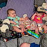 Kamden is registered to the contest to win money with this photo: baby, infant, child, bottle, toy, blanket, plush_toy, pillow, clothing, hat, face, person, sitting, cute, indoors, colorful, smiling, playful, bedding, feeding