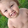 child, toddler, smiling, happy, outdoor, grass, greenery, face, bare_chested, hair_tie, cute, young_child, portrait, daylight, nature, skin, person, close_up, cheerful, baby