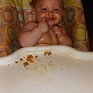 Sapphire joined the competition — help win amazing prizes! baby, high_chair, messy, food, smiling, face, hands, child, indoor, seat, cushion, animal_pattern, cute, fun, eating, happy, plump, infant, meal_time, portrait