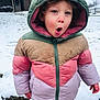 child, winter_jacket, hood, snow, outdoor, cold_weather, expression, face, young_child, curly_hair, sidewalk, house, tree, pink, green, beige, purple, casual_clothing, winter, daylight