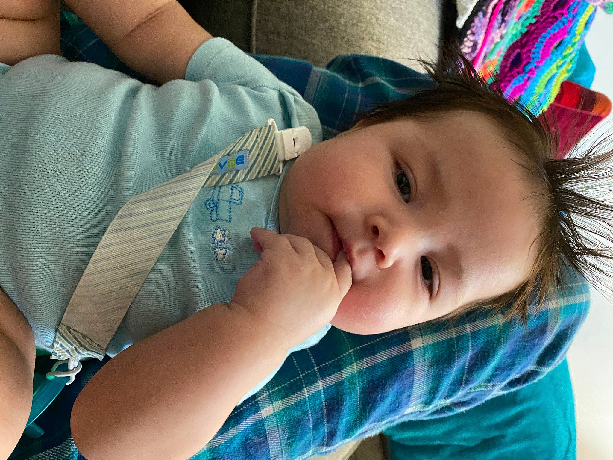 Felix is registered to the contest to win money with this photo: arm, baby, blue, cheek, chin, clothing, comfort, eye, hand, head, human_body, iris, lip, mouth, nose, organ, person, skin, smile, textile
