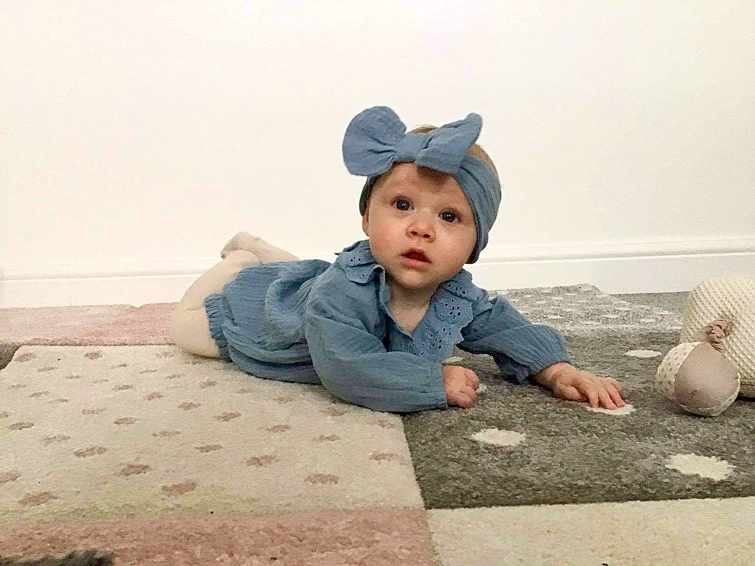 Harleigh is registered to the contest to win money with this photo: asphalt, baby, baby_toddler_clothing, cap, child, crawling, flash_photography, floor, flooring, fun, grass, happy, hat, headwear, landscape, pattern, person, sand, sitting, sun_hat