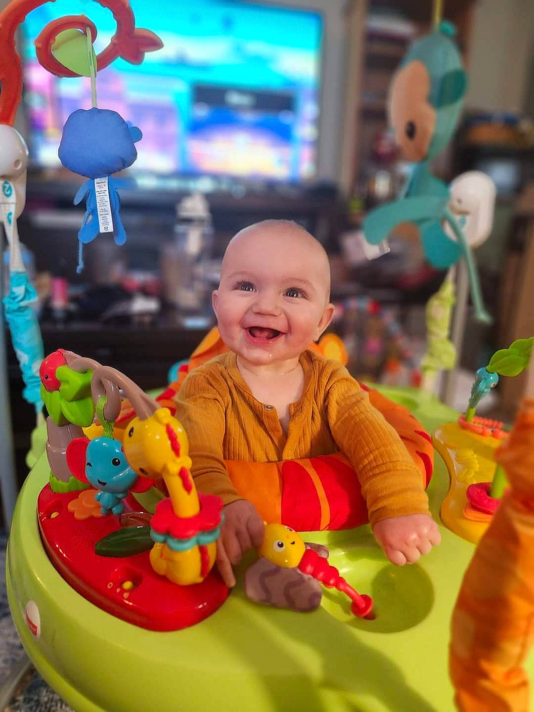 Damian is registered to the contest to win money with this photo: baby, child, city, event, facial_expression, fun, happy, joy, leisure, party, person, photograph, play, product, public_space, recreation, riding_toy, sitting, smile, snapshot