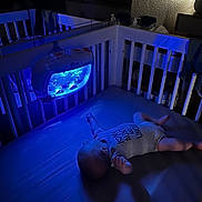 Isaiah joined the competition — help win amazing prizes! baby, crib, blue_light, sleeping, toy, night, bedroom, infant, onesie, calm, peaceful, indoor, soft_light, reflection, furniture, quiet, baby_sleep, room, child, dark