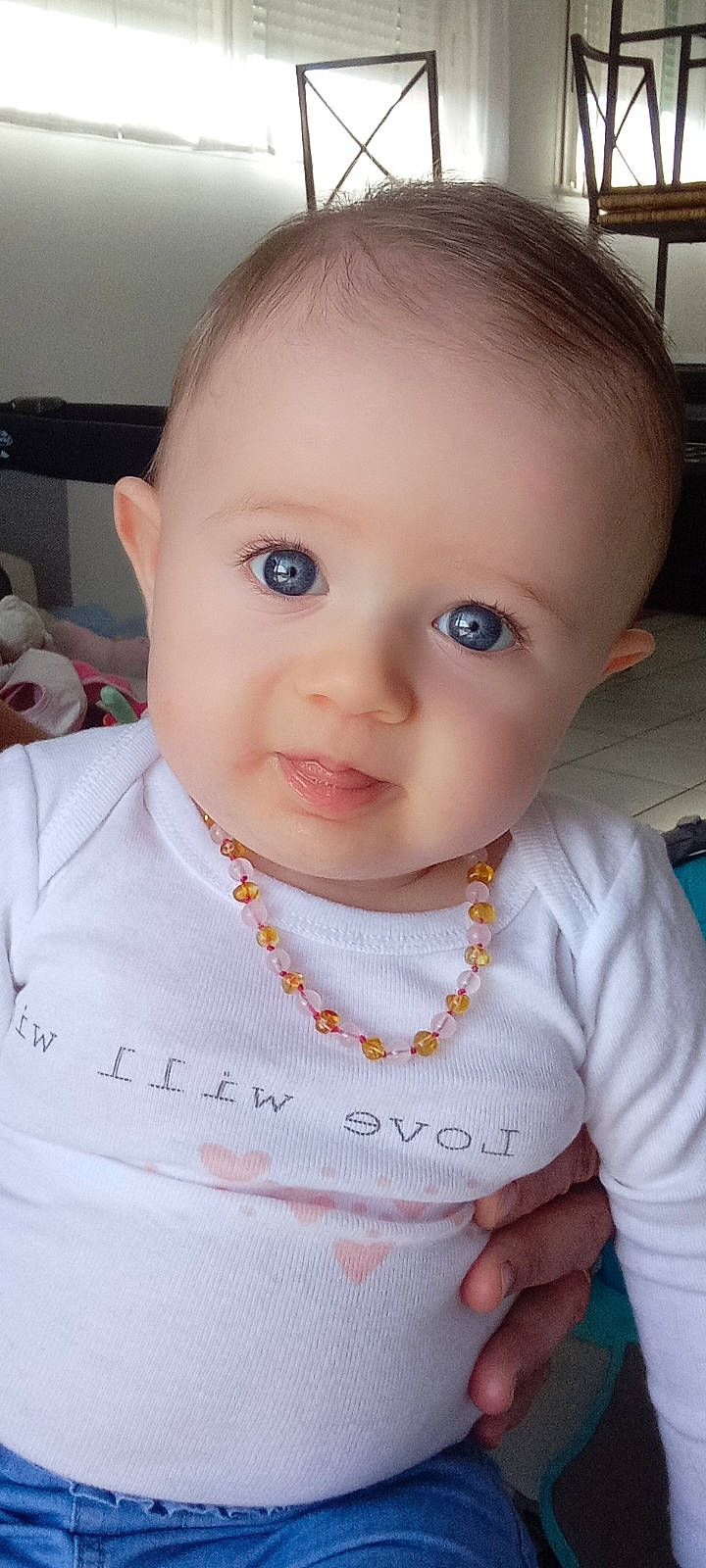 Liana participe au concours pour gagner de l'argent avec cette photo : baby, baby_toddler_clothing, cheek, chin, dress, ear, eyebrow, eyelash, facial_expression, happy, human_body, iris, lip, mouth, neck, nose, person, skin, sleeve, smile