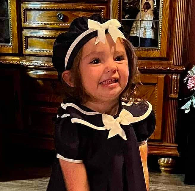 Journey is registered to the contest to win money with this photo: bow_tie, child, costume, costume_hat, drawer, event, facial_expression, fashion_accessory, formal_wear, fun, happy, headband, headwear, joy, organ, person, room, selfie, sleeve, smile
