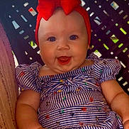 Nova joined the competition — help win amazing prizes! baby, child, smiling, headband, red_bow, striped_dress, seated, happy, face, arms, blue_eyes, infant, cute, portrait, indoors, colorful, clothing, person, young, head