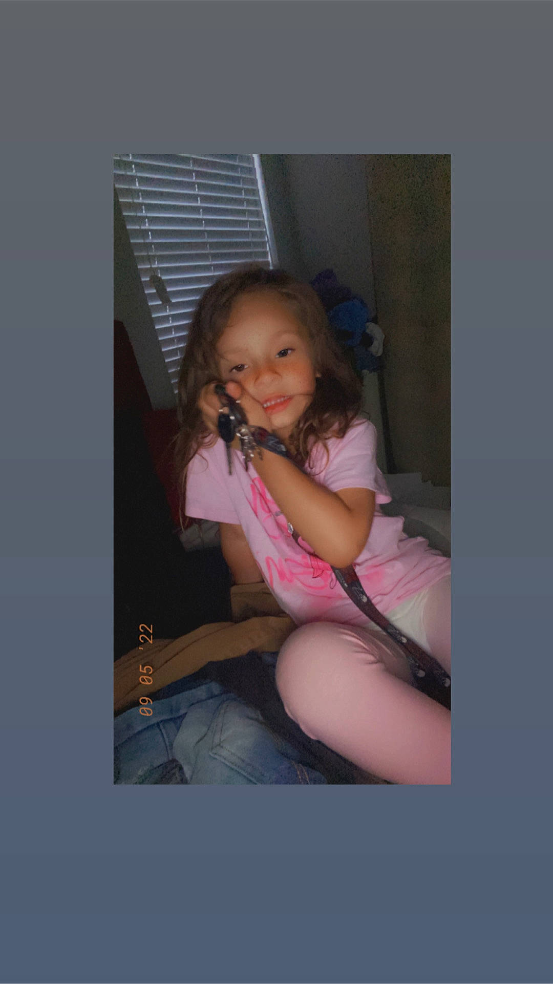 Athena is registered to the contest to win money with this photo: abdomen, comfort, elbow, flash_photography, fun, happy, human_leg, jeans, knee, lap, leg, magenta, person, shorts, sitting, skin, smile, t_shirt, thigh, toddler