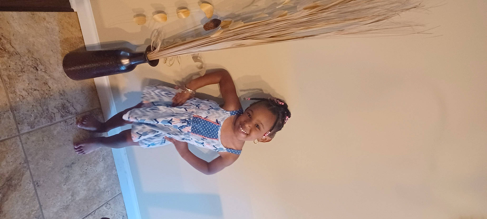 Amiya is registered to the contest to win money with this photo: ceiling, elbow, fashion_design, fun, happy, hardwood, human_leg, joy, knee, leisure, person, plaster, room, shorts, sunglasses, thigh, toddler, tree, wood, wrist