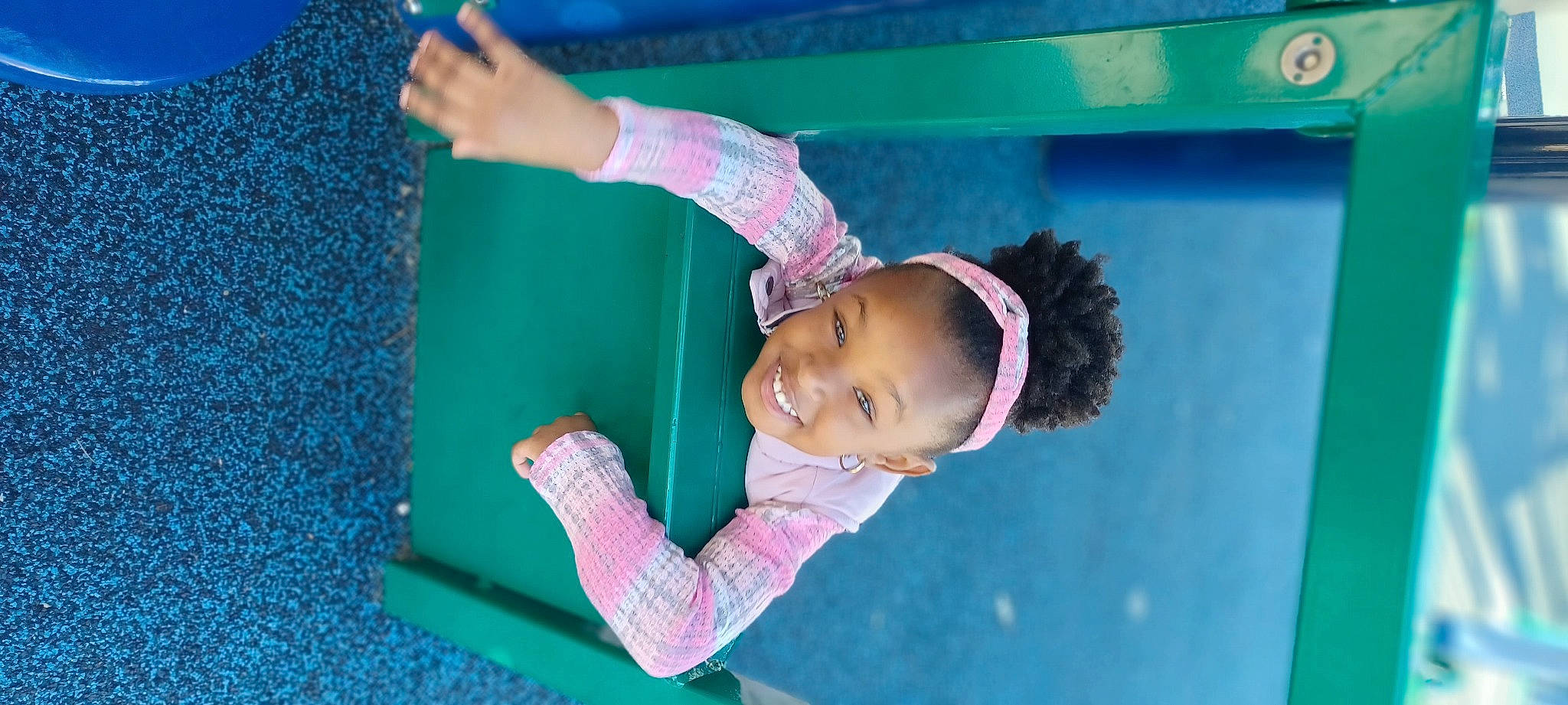 Amiya is registered to the contest to win money with this photo: child, electric_blue, fun, grass, happy, joy, leisure, magenta, outdoor_play_equipment, person, pink, play, playground, recreation, room, smile, snapshot, summer, toddler, vacation