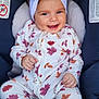 baby, child, infant, onesie, headband, bow, car_seat, smiling, happy, cute, clothing, pattern, leaf, autumn, seatbelt, indoor, portrait, baby_girl, comfort, closeup