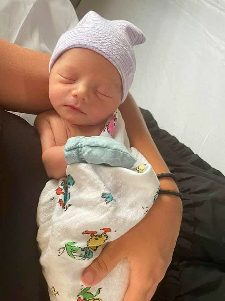 Benji joined the competition — help win amazing prizes! baby, baby_products, baby_sleeping, baby_toddler_clothing, cap, cheek, child, comfort, elbow, finger, hand, hat, headwear, human_leg, pattern, person, sitting, skin, sleeve, thumb