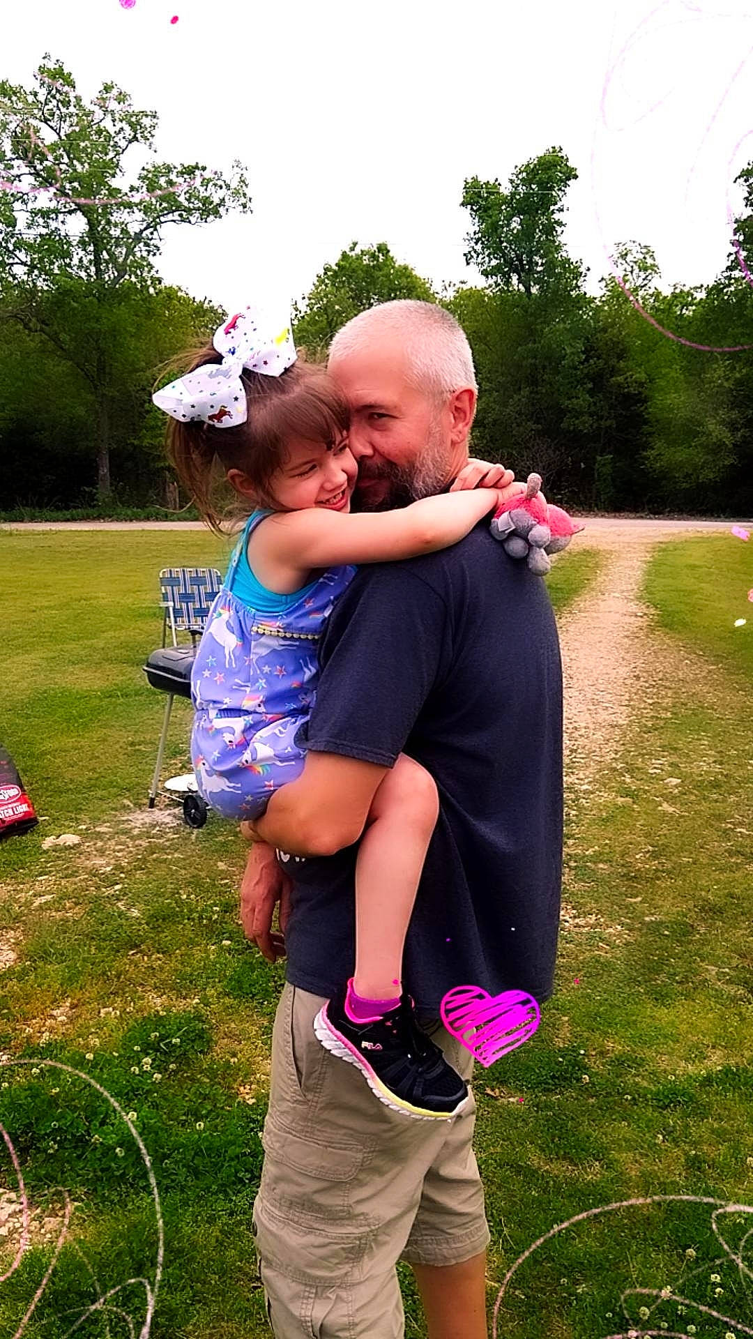 Rebel Rose is registered to the contest to win money with this photo: event, facial_expression, fun, gesture, grass, grassland, happy, interaction, joy, lawn, leisure, meadow, people_in_nature, person, pink, plant, recreation, shorts, sky, t_shirt