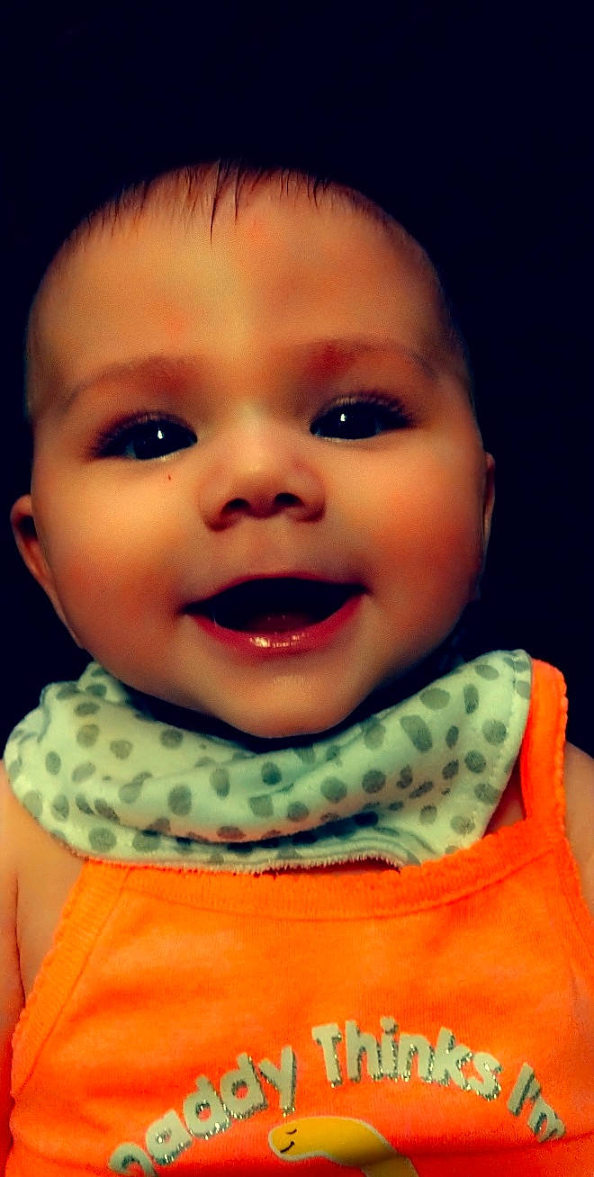 Esme joined the competition — help win amazing prizes! baby, cheek, chin, collar, cool, eyebrow, eyelash, flash_photography, forehead, happy, iris, jaw, lip, mouth, neck, nose, orange, person, skin, sleeve