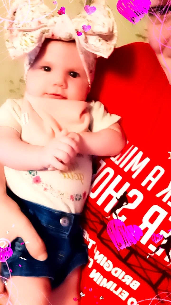 Esme is registered to the contest to win money with this photo: abdomen, baby, baby_toddler_clothing, cap, chest, child, clothing, eye, happy, hat, human_leg, lip, magenta, muscle, navel, person, pink, skin, thigh, toddler