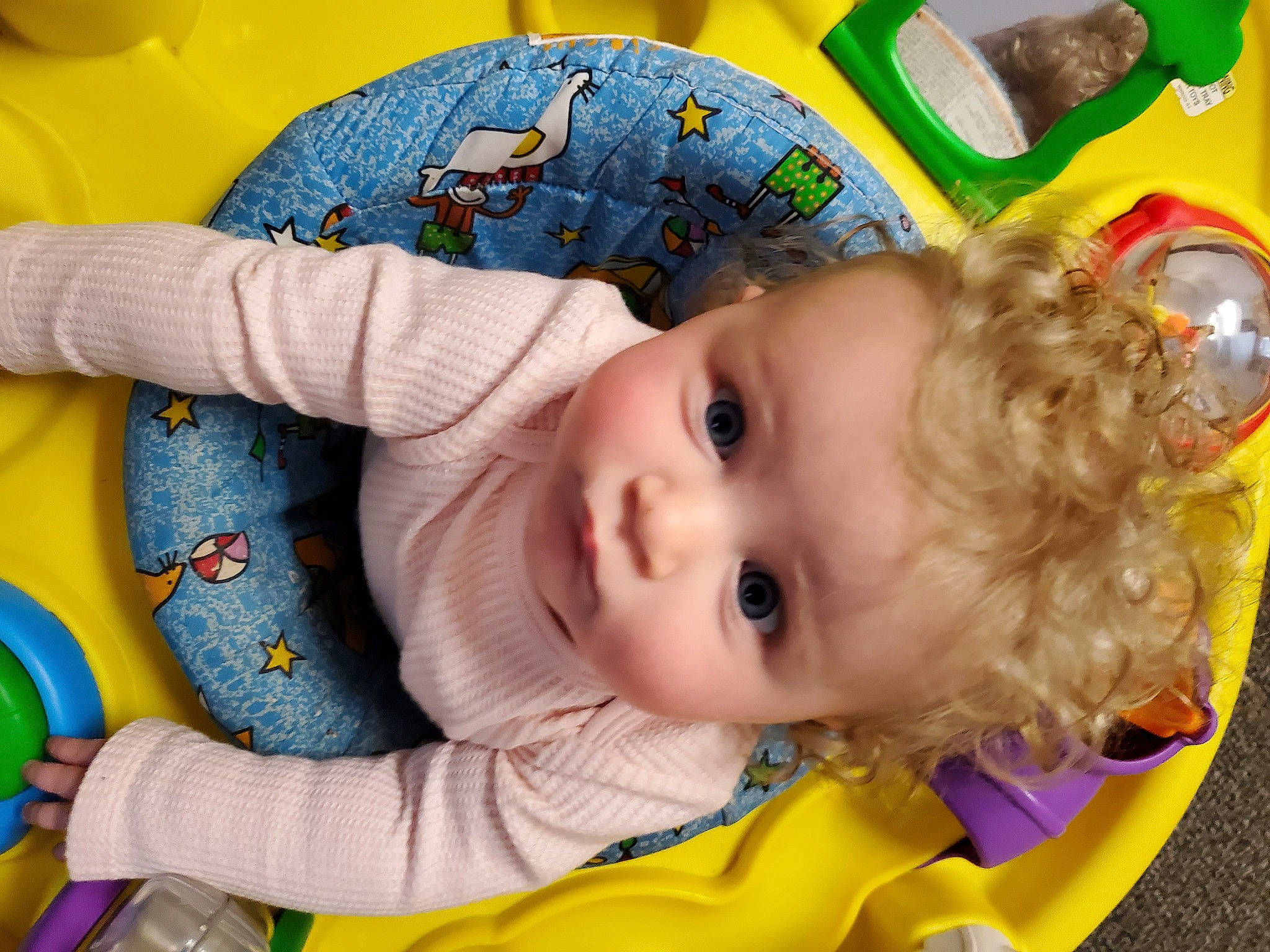 Lex is registered to the contest to win money with this photo: baby, baby_products, baby_toddler_clothing, baby_toys, cheek, child, eye, facial_expression, fun, happy, head, iris, nose, pattern, person, play, room, skin, toddler, toy