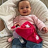 Inaya participe au concours pour gagner de l'argent avec cette photo : baby, infant, smiling, cute, plush_toy, pink_clothing, jeans, socks, cushion, seat, indoor, happy, child, person, toy, relaxing, cozy, portrait, home, floor
