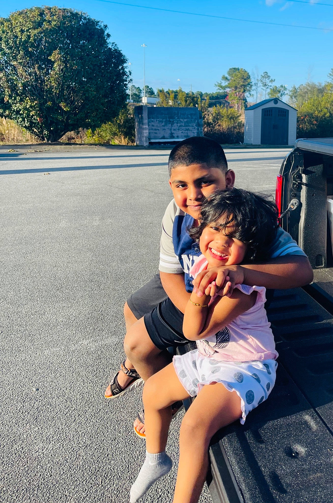 Selina is registered to the contest to win money with this photo: barefoot, electric_blue, eye, foot, grass, happy, human_leg, joy, leg, leisure, person, plant, recreation, sandal, shorts, smile, summer, sunlight, thigh, toddler