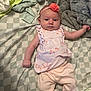 baby, infant, girl, clothing, headband, flower, blanket, bedspread, soft, pink, flamingo, sleepwear, lying_down, cute, child, indoors, fabric, comfort, person, newborn