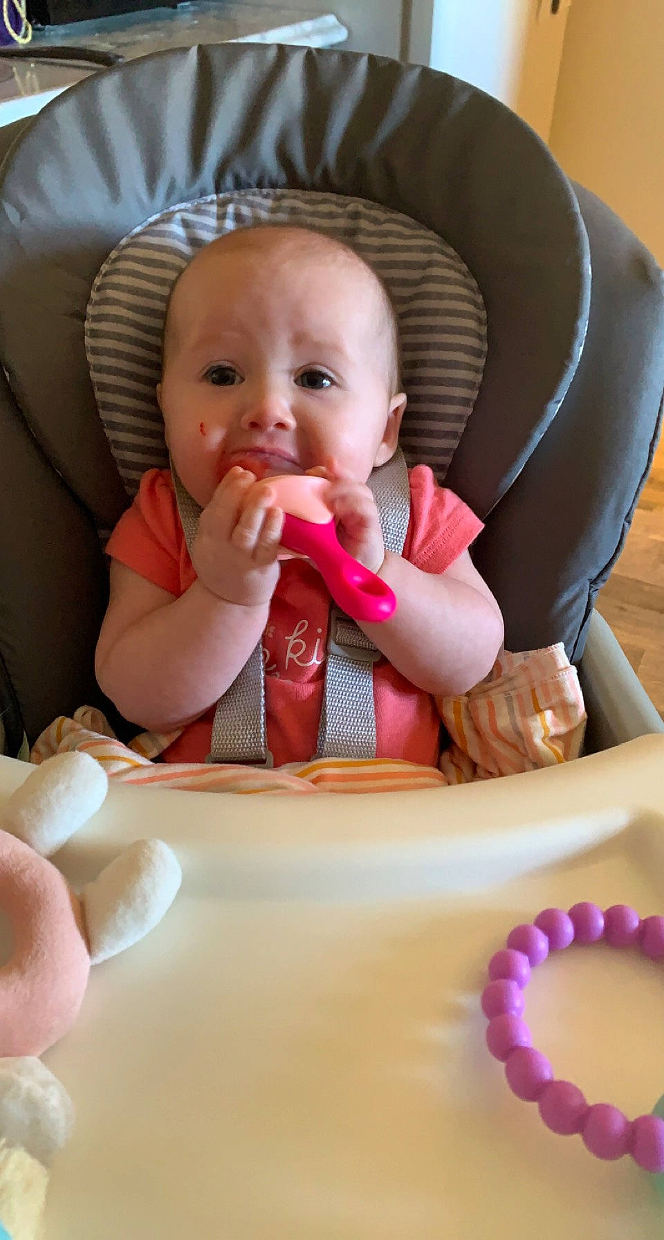 Lily Grace is registered to the contest to win money with this photo: baby, baby_products, baby_toddler_clothing, chair, cheek, child, comfort, dishware, face, finger, food_craving, mouth, nail, person, pink, sitting, skin, sweetness, tableware, thumb