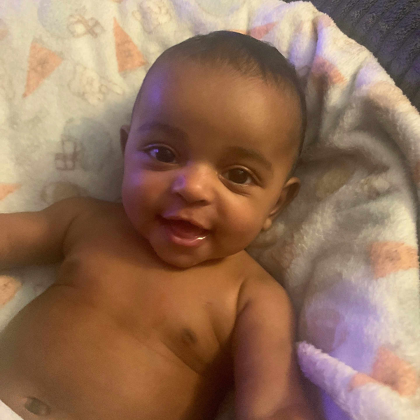 Jonas joined the competition — help win amazing prizes! baby, infant, child, smiling, portrait, close_up, lying_down, blanket, bed, diaper, bare_chested, indoor, cozy, happy, face, eyes, mouth, soft_lighting, home, nursery