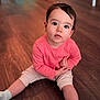baby, casual, child, curious, cute, expression, floor, home, indoor, innocent, long_sleeve, looking_up, person, pink_clothing, portrait, sitting, socks, toddler, wooden_floor, young_child