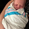 Asher joined the competition — help win amazing prizes! newborn, baby, infant, wrapped, blanket, striped_blanket, sleeping, person, arm, skin, closeup, indoors, resting, peaceful, soft_light, human, portrait, tender, care, comfort